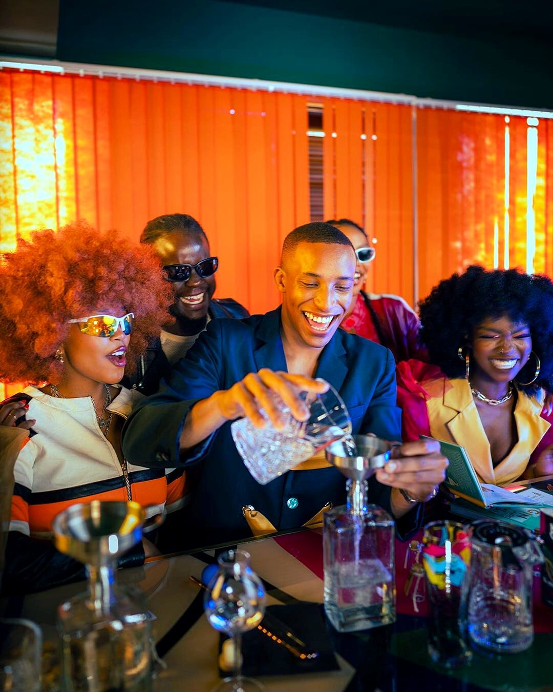 A bartender pouring a drink at a Kenyan Originals event